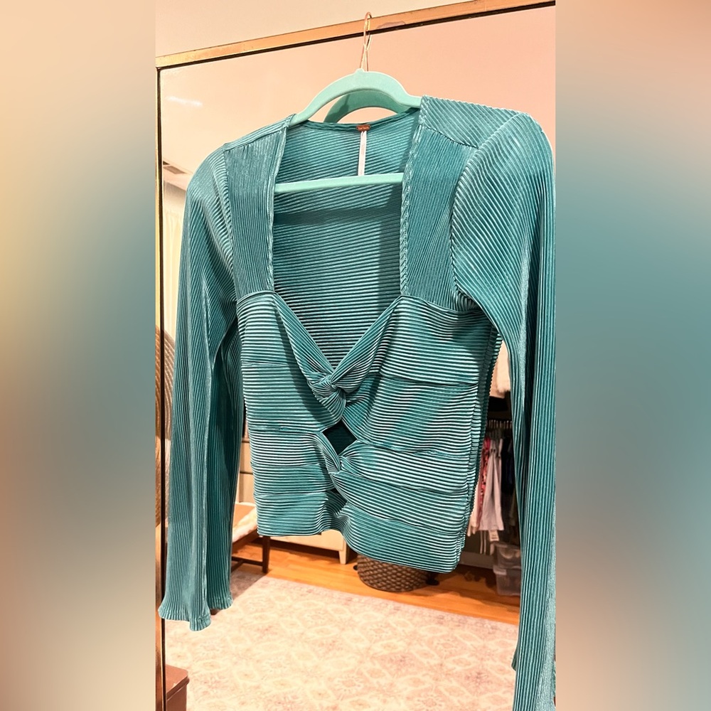 Free People soft and shimmery turquoise cropped long sleeve top